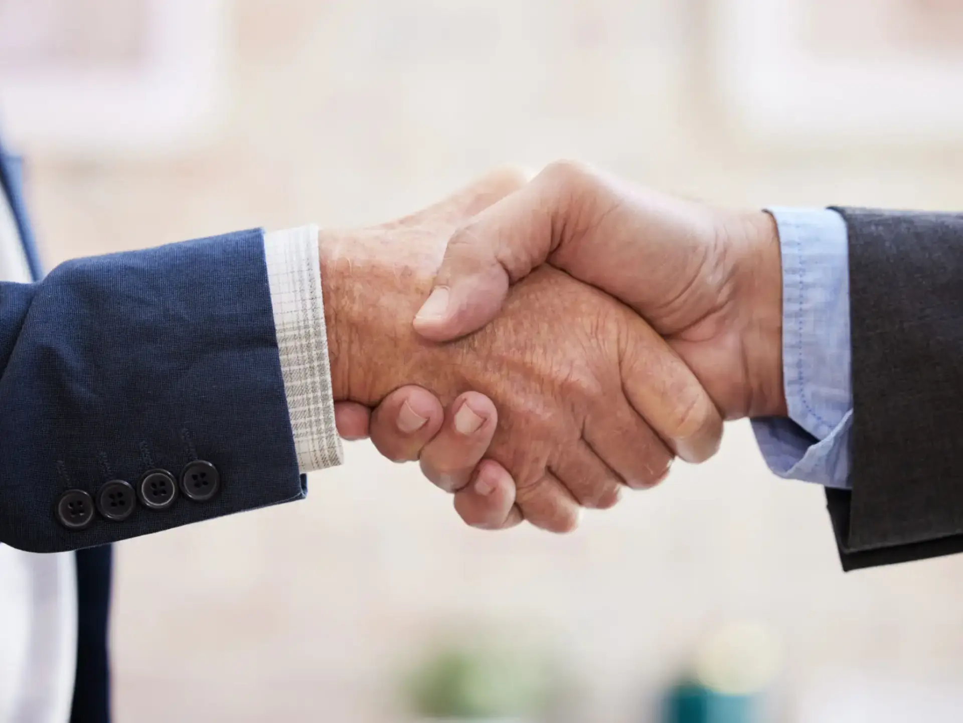 Business partnership handshake